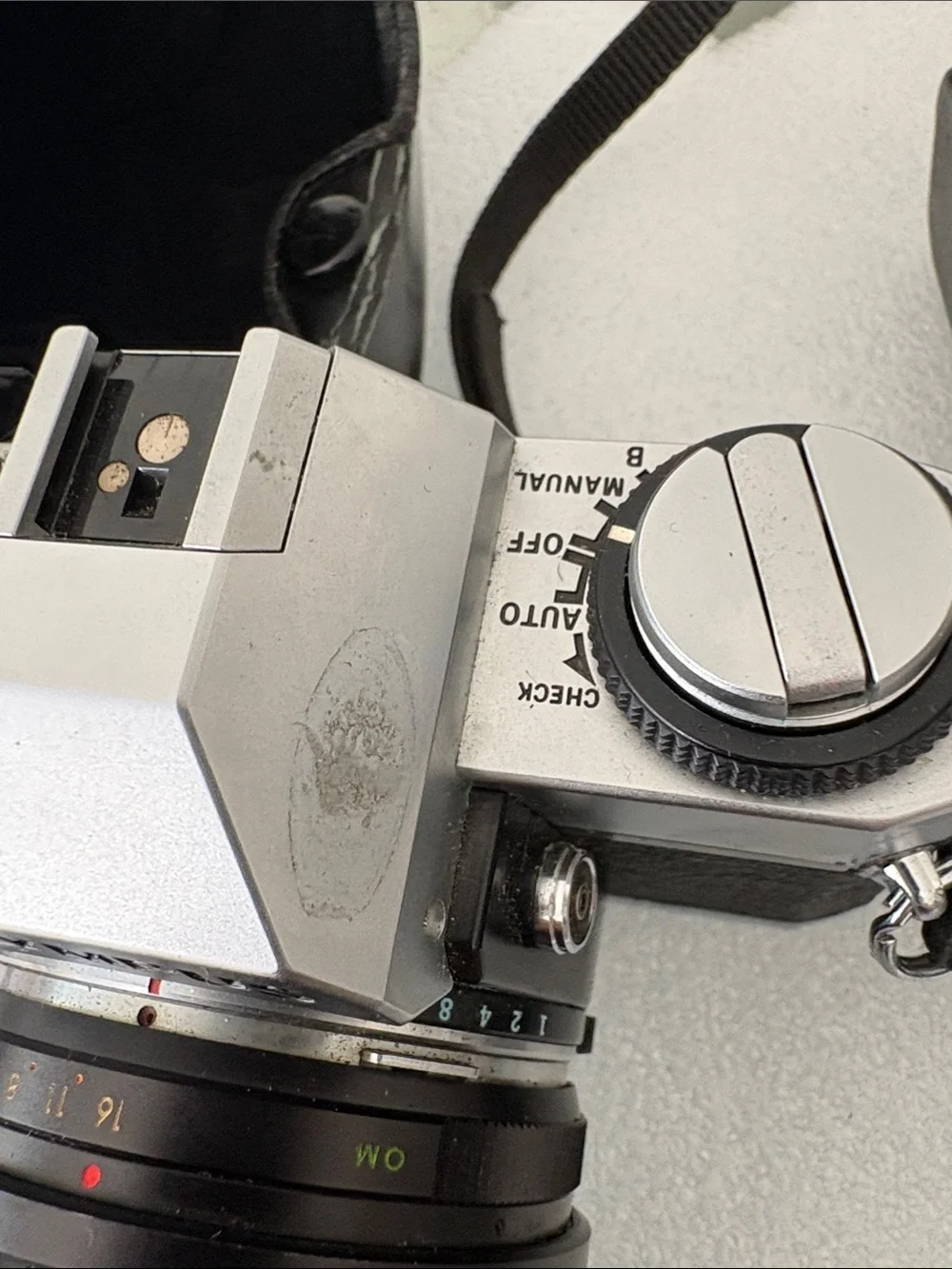 Olympus Silver and Black 35mm SLR Camera with Black Zoom Lens parts not tested
